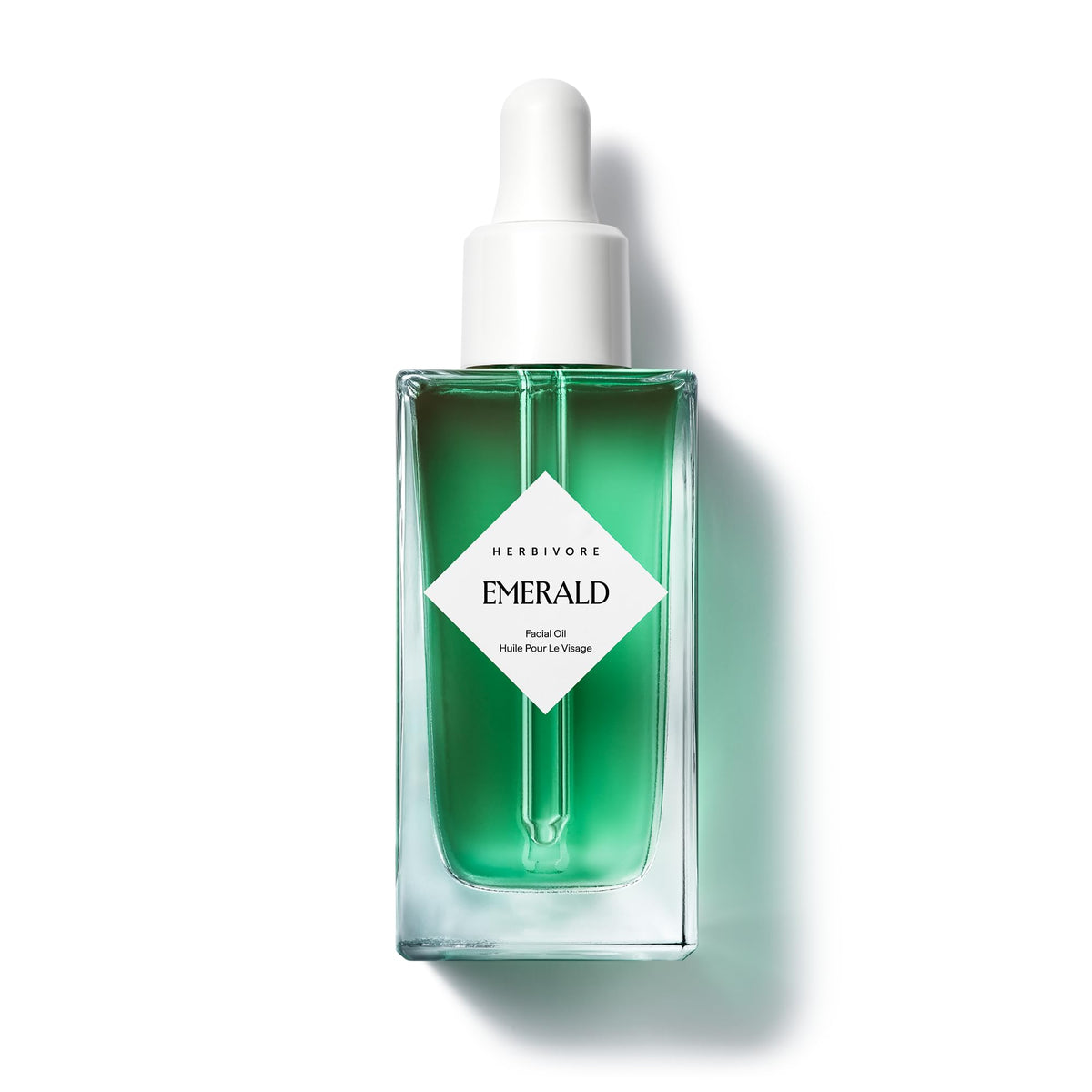 HERBIVORE bottle front view showing calming facial oil and packaging benefit