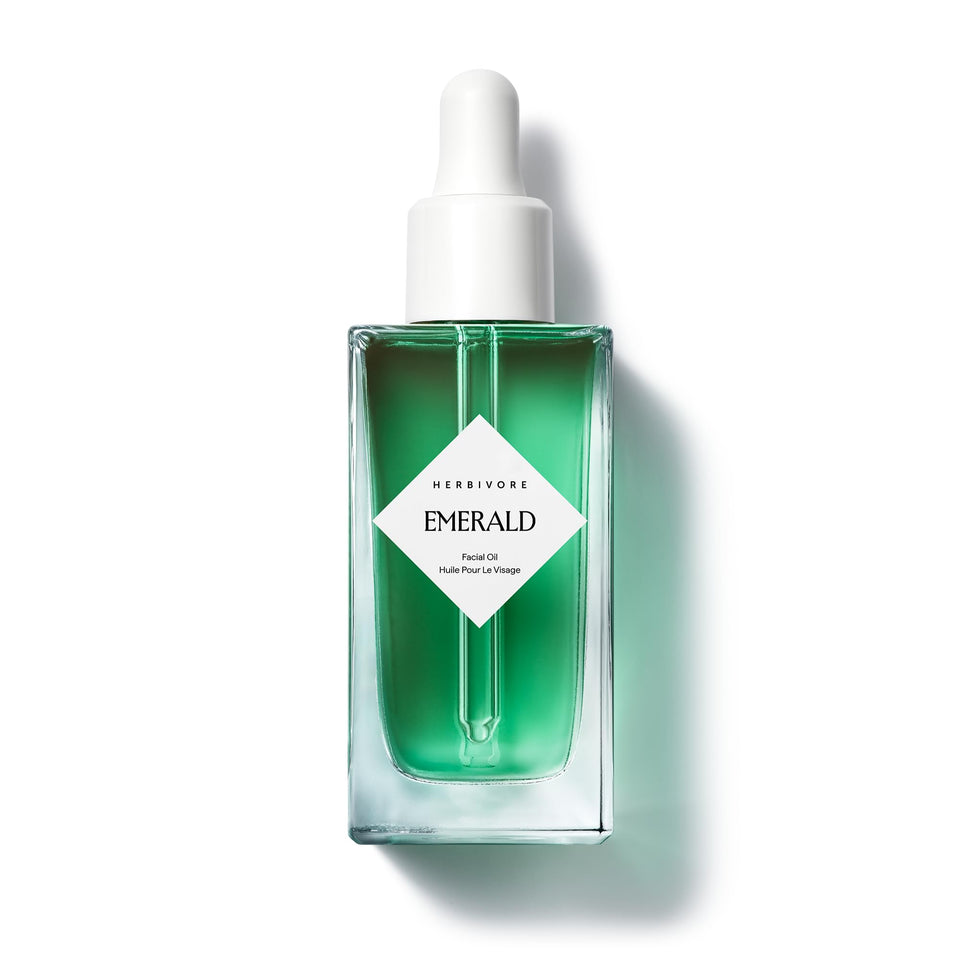 HERBIVORE bottle front view showing calming facial oil and packaging benefit