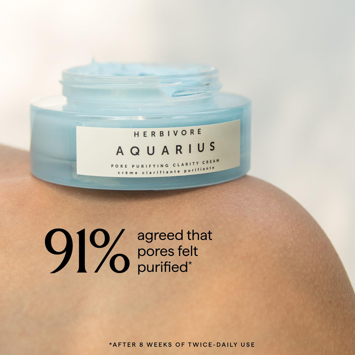 HERBIVORE moisturizer in hand demonstrating size and quick-absorb benefit