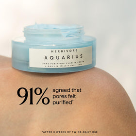 HERBIVORE moisturizer in hand demonstrating size and quick-absorb benefit