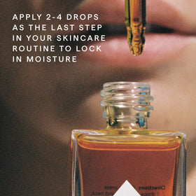 HERBIVORE bottle in hand showing 50 mL scale and travel-friendly benefit