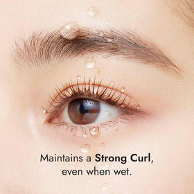 Heroine Make mascara in use on curled lashes showing long-lasting hold
