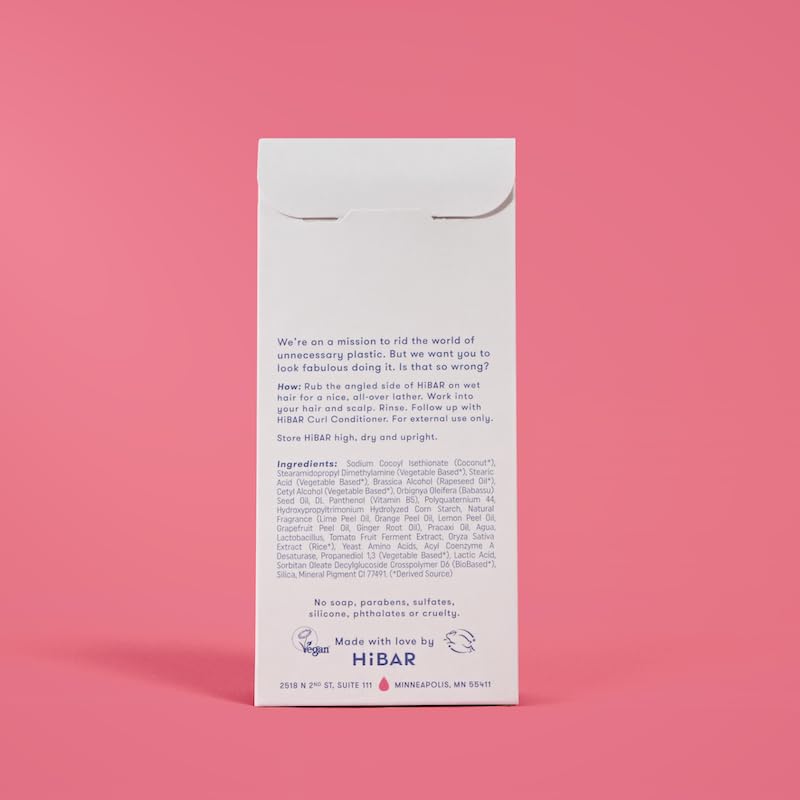 HIBAR curl shampoo bar on a bathroom shelf with towel, depicting plastic-free lifestyle benefit