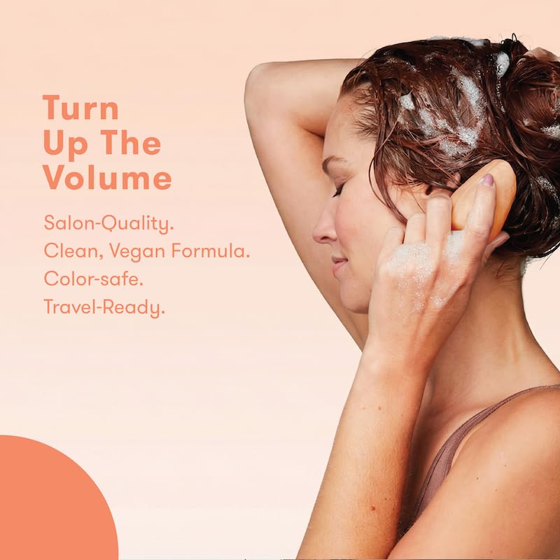 HIBAR shampoo bar held in hand to show size and travel convenience