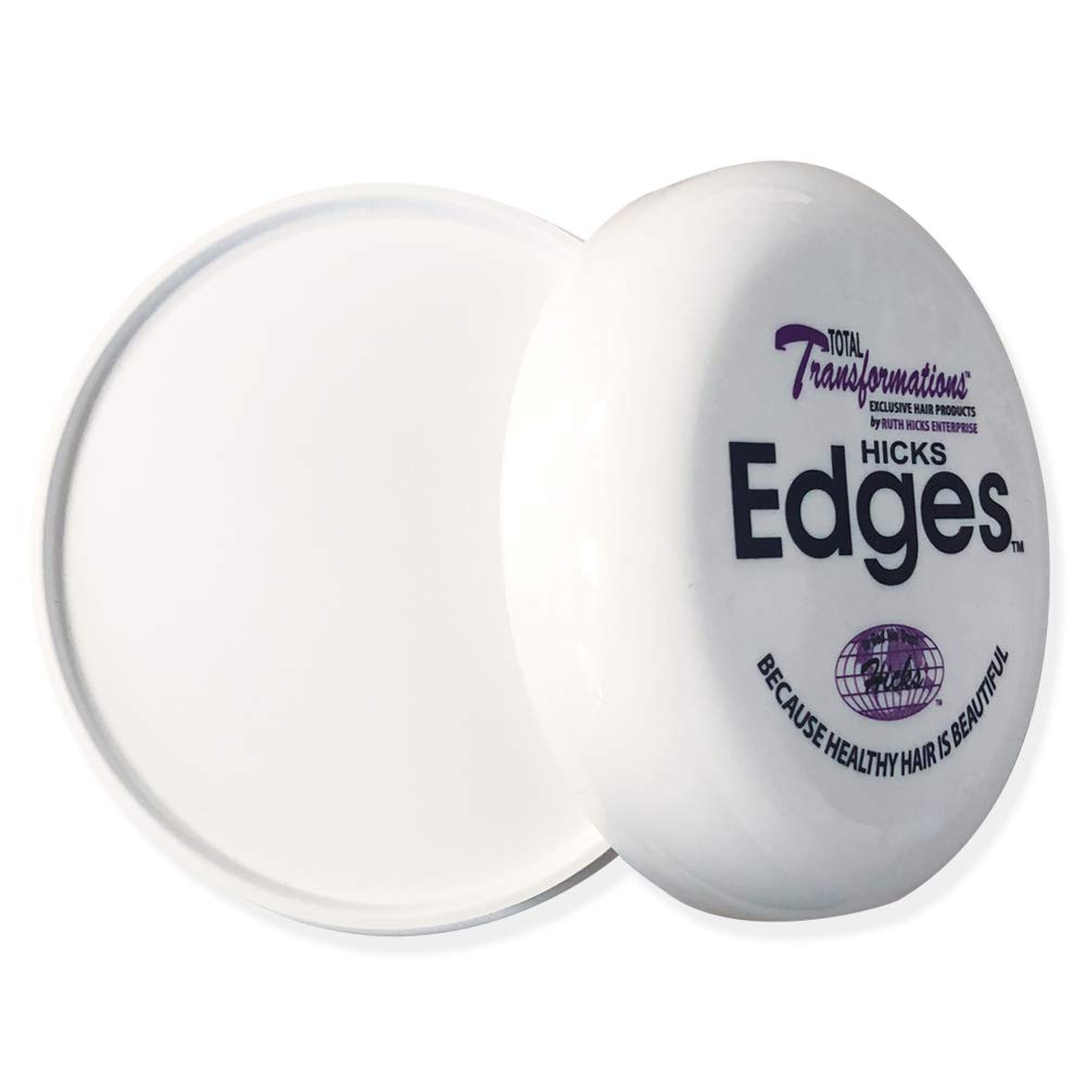 Hicks applying pomade to hairline with brush for precise edge control