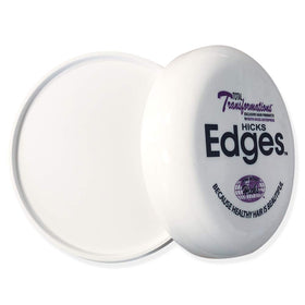 Hicks applying pomade to hairline with brush for precise edge control