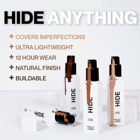 Hide foundation swatches on arm comparing tones to help choose the right shade