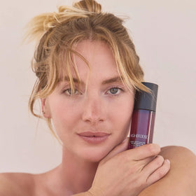 HigherDOSE hand application photo showing serum absorption benefit for immediate hydration