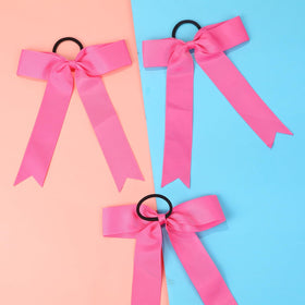 Hipcheer bow on teen ponytail in action showing secure hold and visible tail