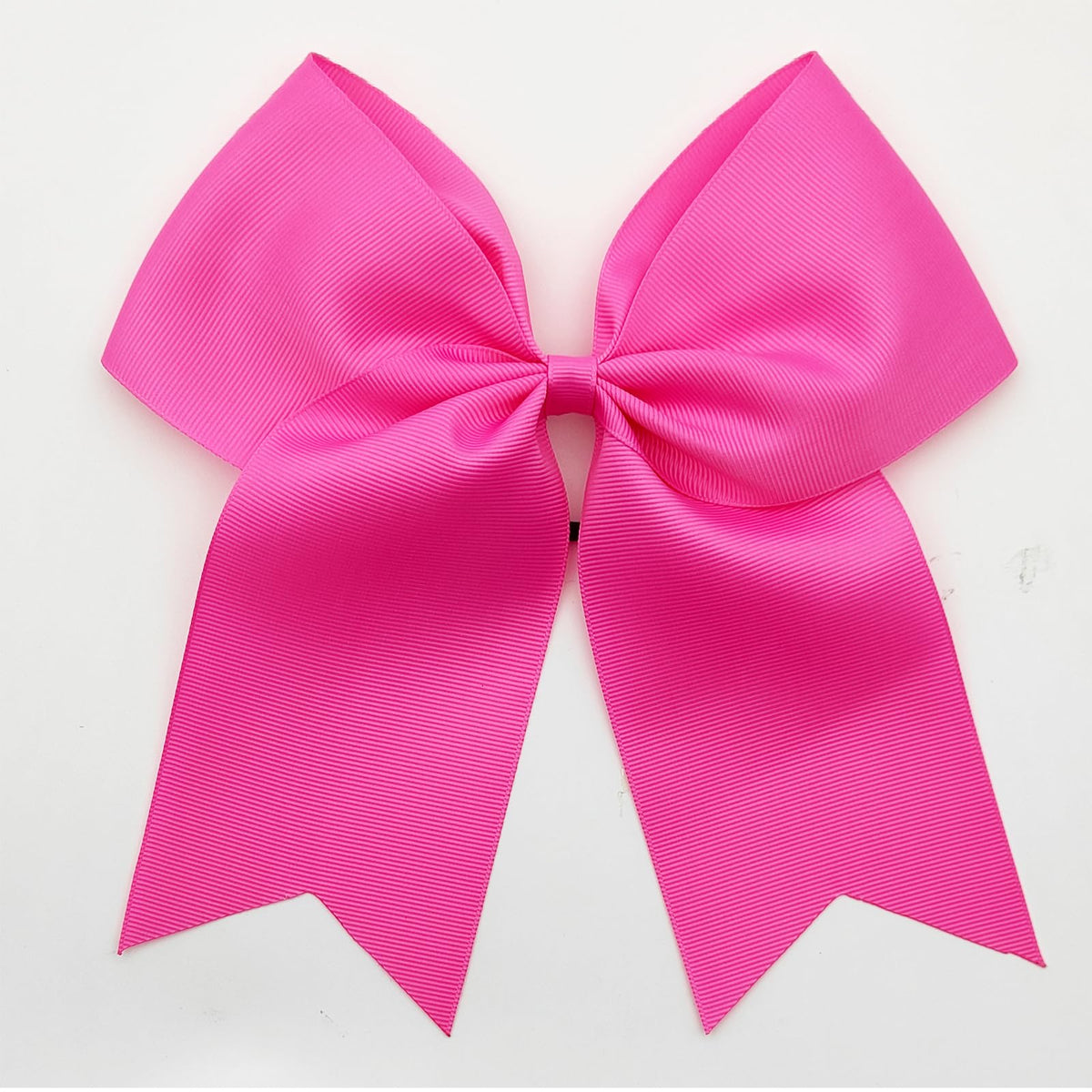 Hipcheer bow worn at cheer practice showing coordinated team spirit benefit