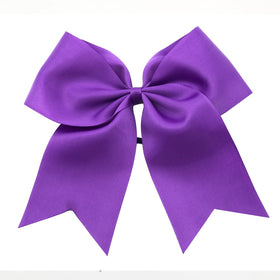 Hipcheer bow next to ruler showing 8-inch size for visible impact
