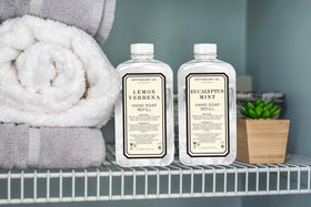 Home & Body Company bottles beside sink in bathroom to show convenient everyday use