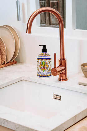 Home & Body Company product in bathroom setting adding elegant countertop decor