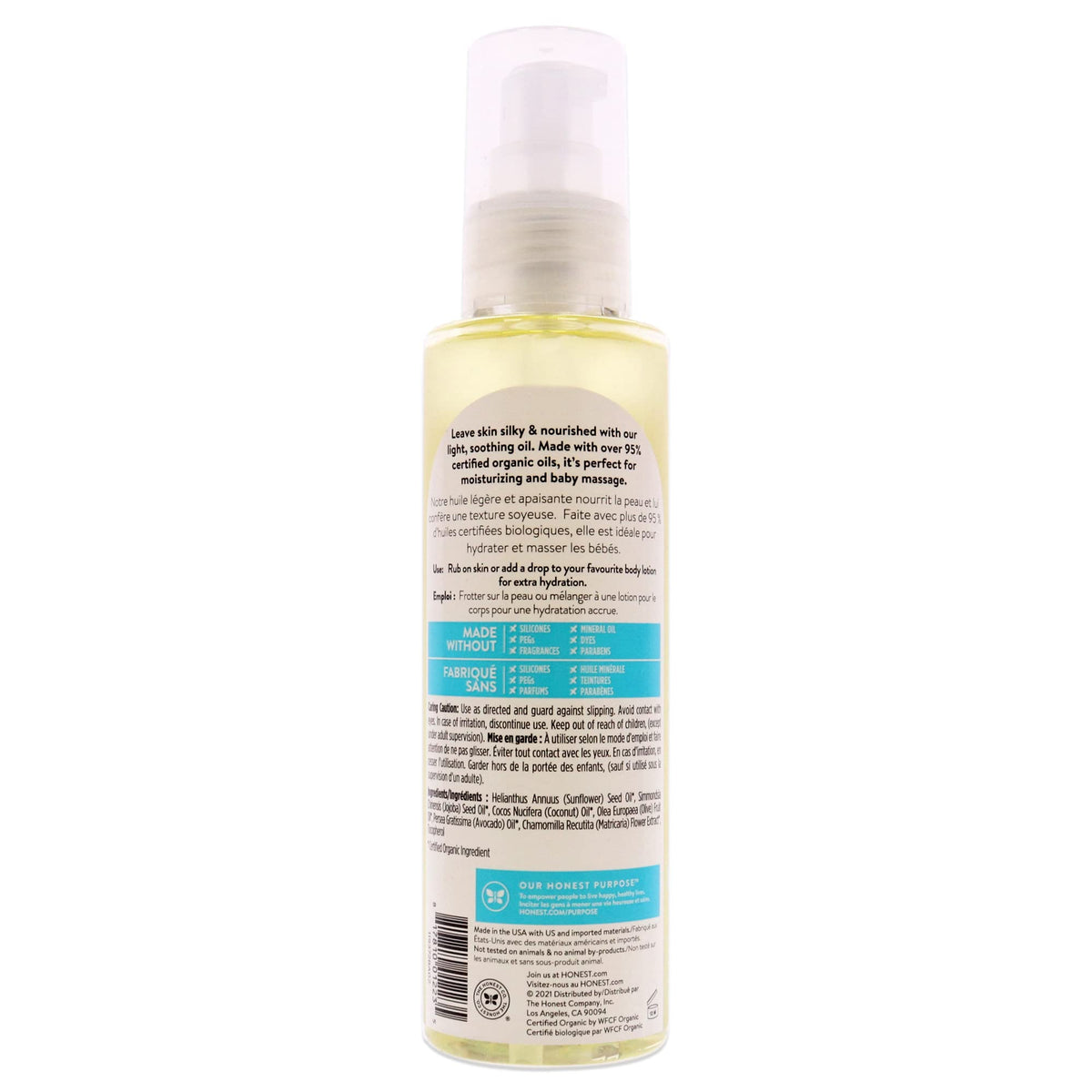 The Honest Company oil poured onto palm, showing texture and easy absorption benefit