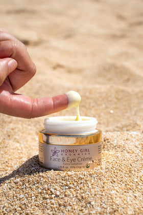 Honey Girl Organics applying creme around eye area demonstrating gentle soothing benefit