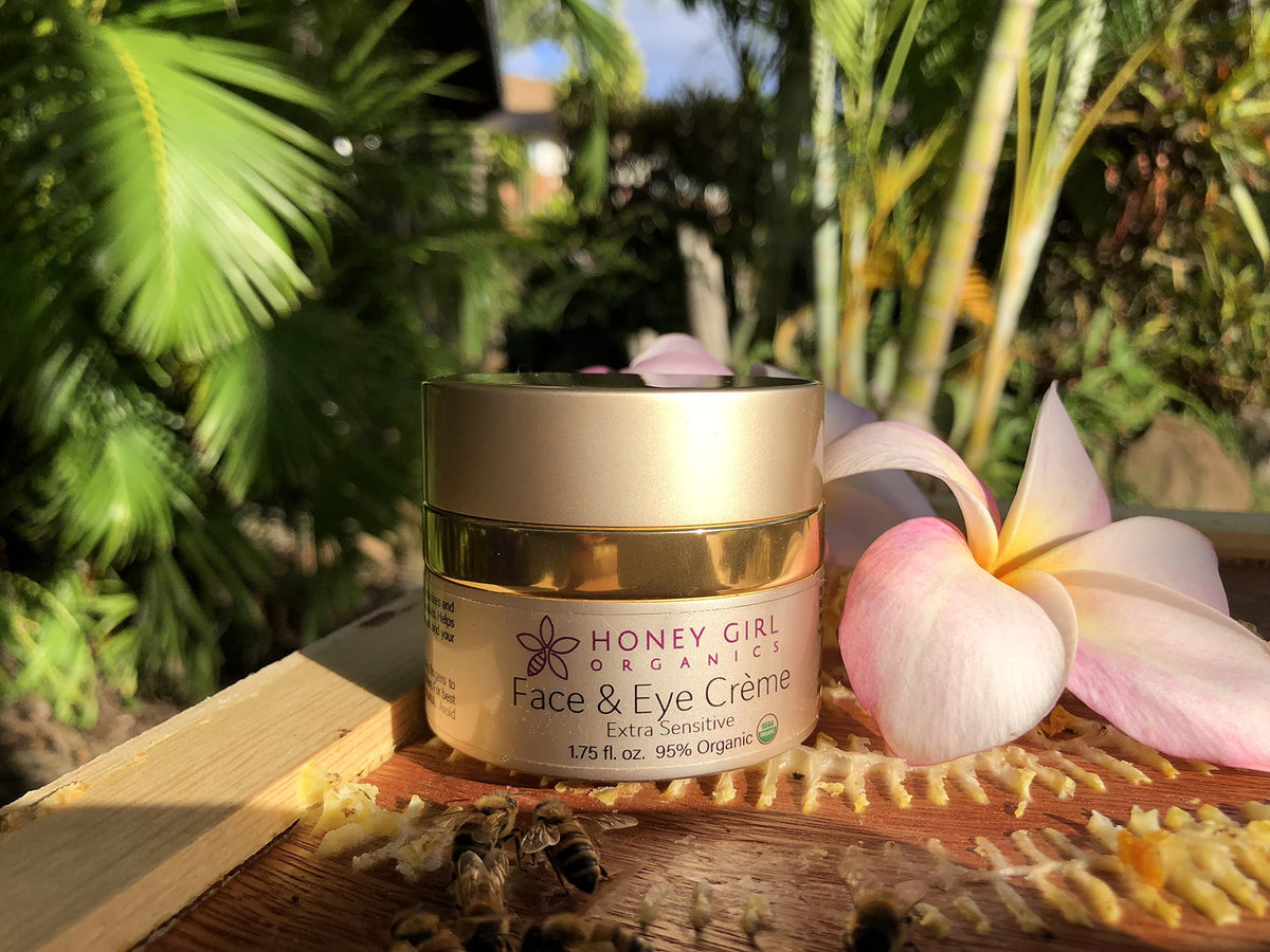 Honey Girl Organics jar held in hand showing compact size for travel benefit