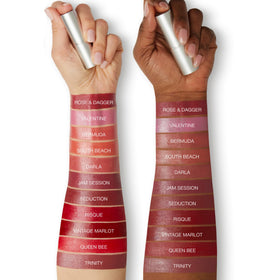 Honeybee Gardens lipstick held in hand to show compact size and portability
