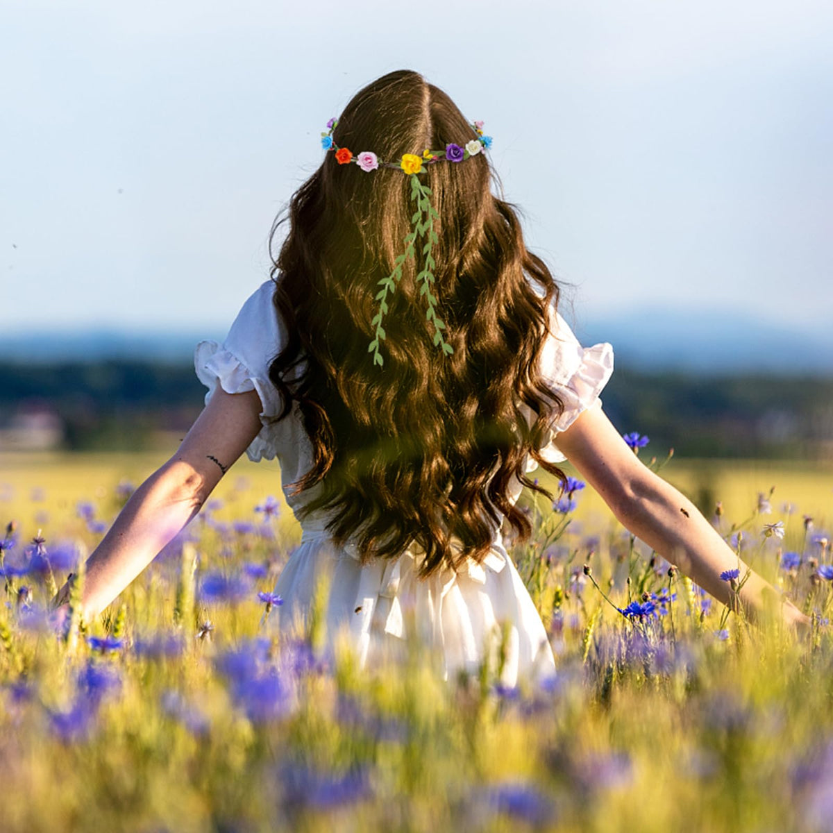 HONLYNE crowns worn at a wedding party adding colorful, boho-style accents