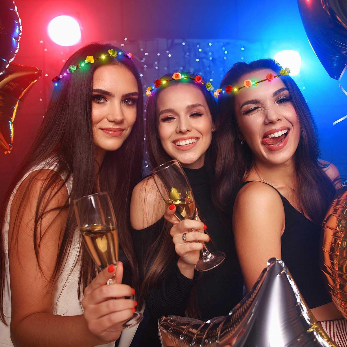 HONLYNE group at event wearing crowns showing coordinated festive effect