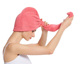HOPESHINE towel next to hand illustrating size and lightweight portability