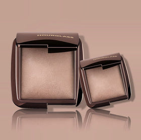 HOURGLASS powder applied on cheek in lifestyle setting demonstrating natural luminous glow