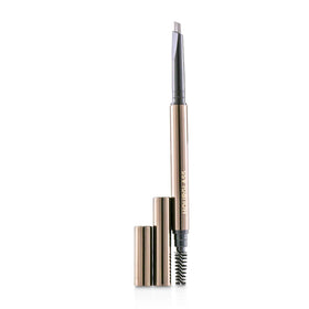 Hourglass spoolie blending brows on model demonstrating groomed shape and natural hold