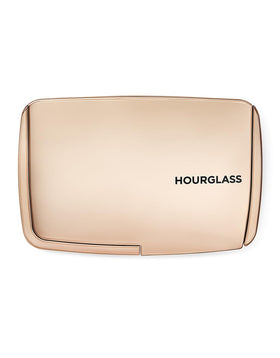 Hourglass close-up of powder texture highlighting fine-milled, blurring finish