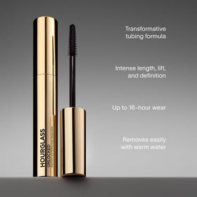 Hourglass model wearing mascara showing fanned lashes and long-lasting wear