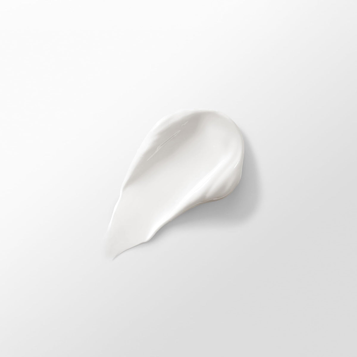 HOURGLASS texture close-up showing silky cream and rapid absorption benefits