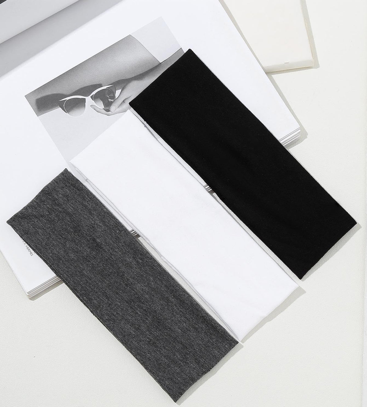 Huachi color array flatlay displaying neutral shades for versatile outfit matching