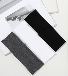 Huachi color array flatlay displaying neutral shades for versatile outfit matching