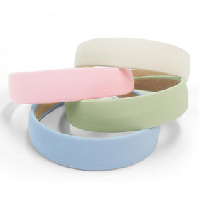 Huachi headband worn with ponytail demonstrating non-slip hold benefit