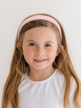Huachi headband styled in bedroom mirror scene showing easy everyday outfit enhancement