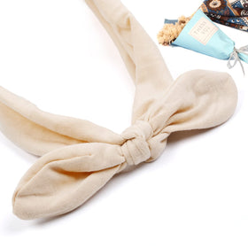 Huachi headband beside ruler illustrating stretchable 9 to 14 inch fit