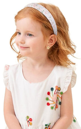 Huachi styled with updo demonstrating boho-chic finishing touch