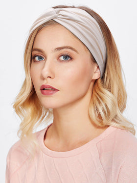 Huachi headband folded inside a bag showing travel-friendly compactness