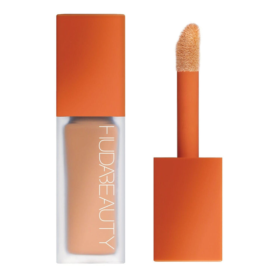 HUDA BEAUTY front packaging showing peach corrector and applicator, brightening effect