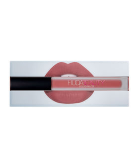 Huda Bombshell lip swatch closeup displaying rich matte color and defined finish