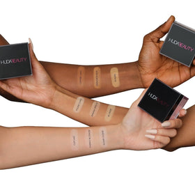 Huda Beauty Cherry Blossom being applied under eye demonstrating brightening effect