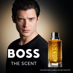 Hugo Boss shower gel held in hand showing compact 5.1 fl oz size for travel convenience