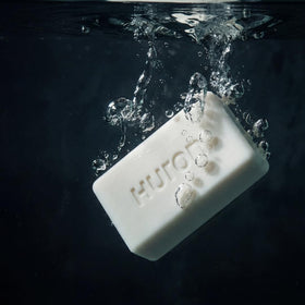 Huron bar on soap dish displaying easy drainage for longer-lasting benefit