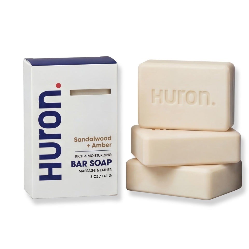 Huron front packaging showing sandalwood amber scent and benefit of clean ingredients