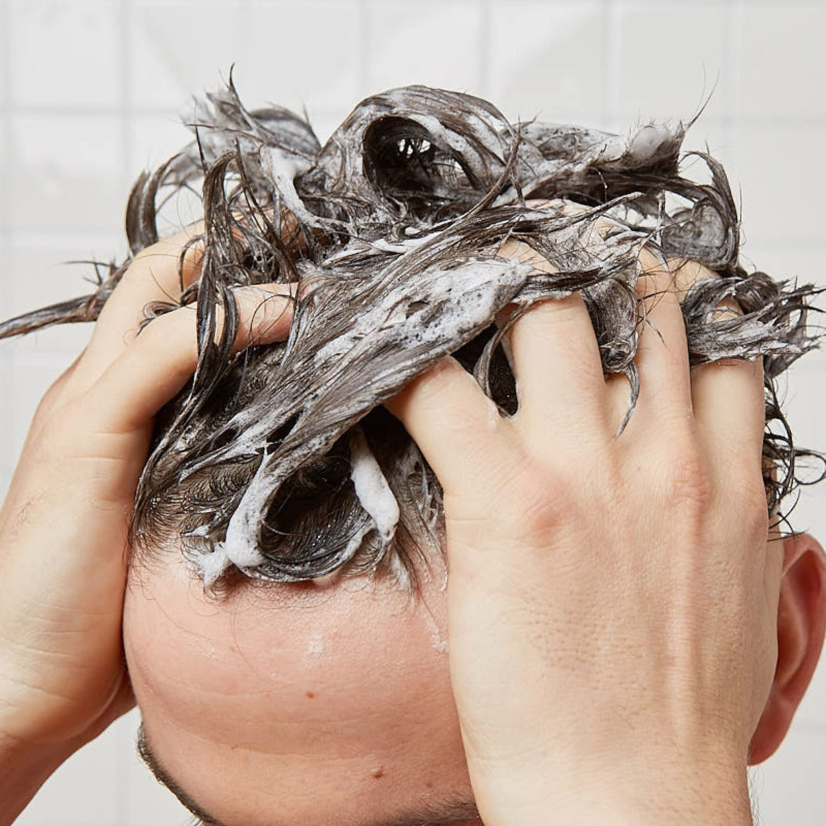 Huron shampoo on bathroom shelf in lifestyle setting showing refreshed grooming routine