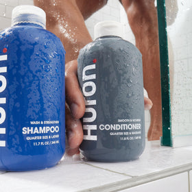 Huron conditioner on bathroom vanity in lifestyle scene showing fresh, citrus scent