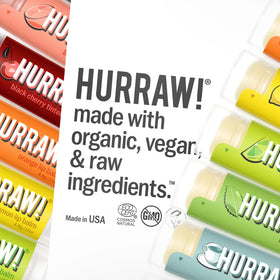 HURRAW! person applying balm outdoors showcasing subtle color and comfortable wear during activities