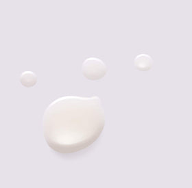 Huxley oil essence in hand during application, shows lightweight spread and coverage