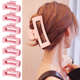HXOGD clip next to hand for scale showing compact practical size