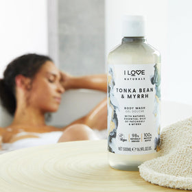 I LOVE bottle pouring body wash into hand, demonstrating creamy lather and gentle cleansing
