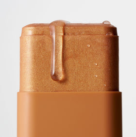 ICONIC LONDON swiped on shoulder for body glow, highlights dewy finish