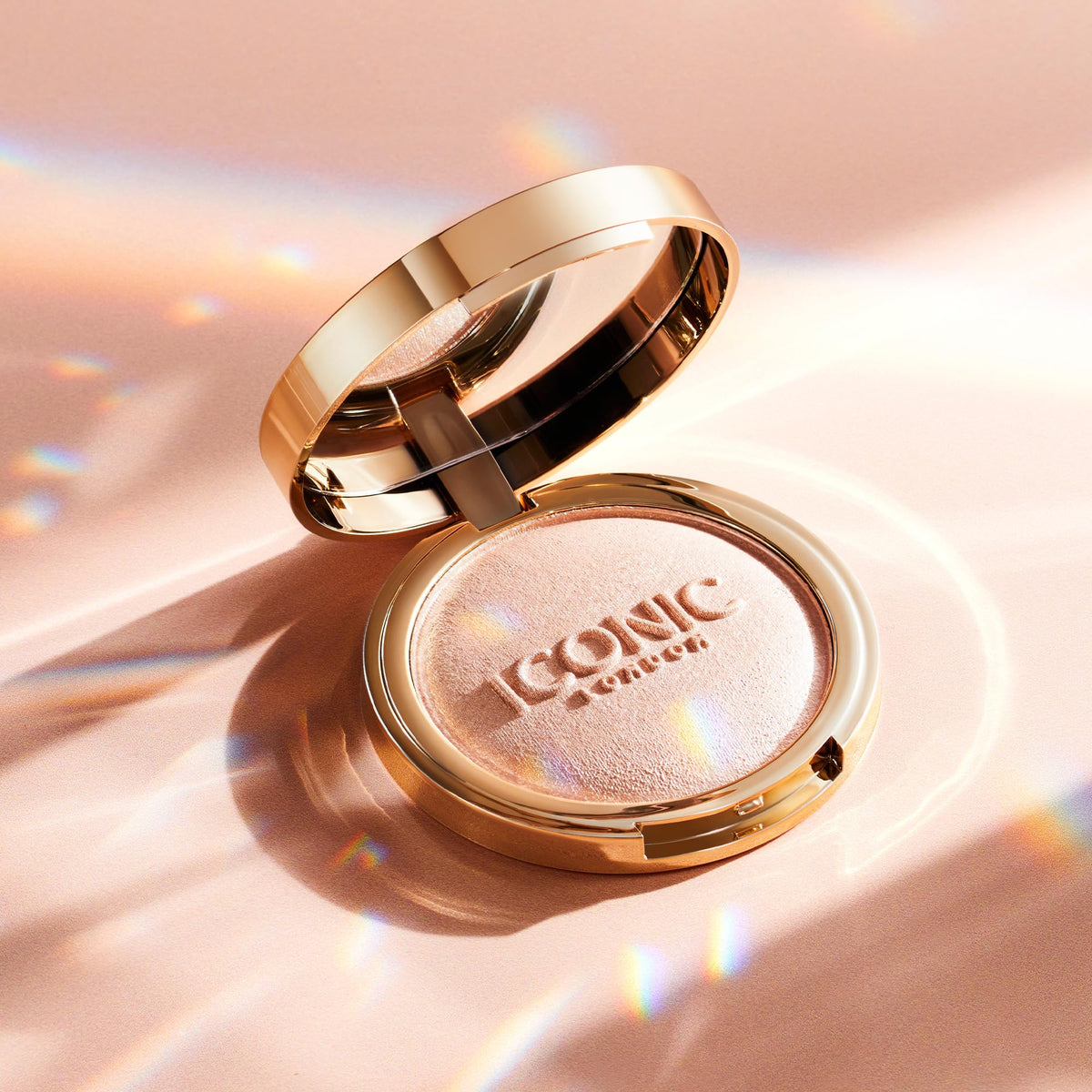 ICONIC LONDON compact next to coins and keys showing travel-friendly size